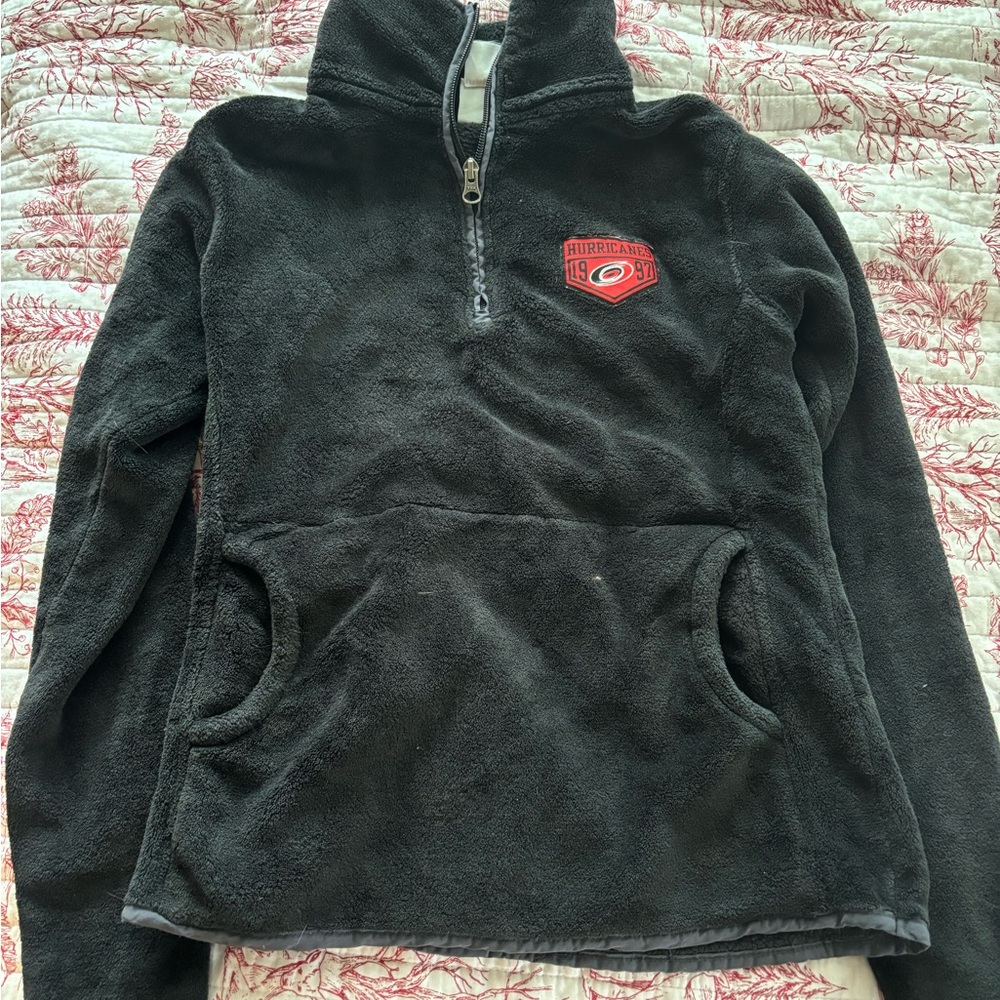 Women’s black hurricanes pull over